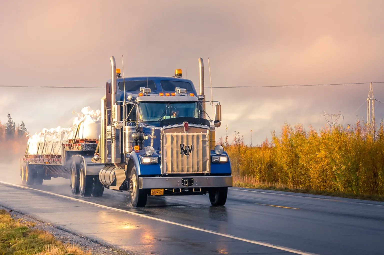 A commercial truck driving down the highway.
