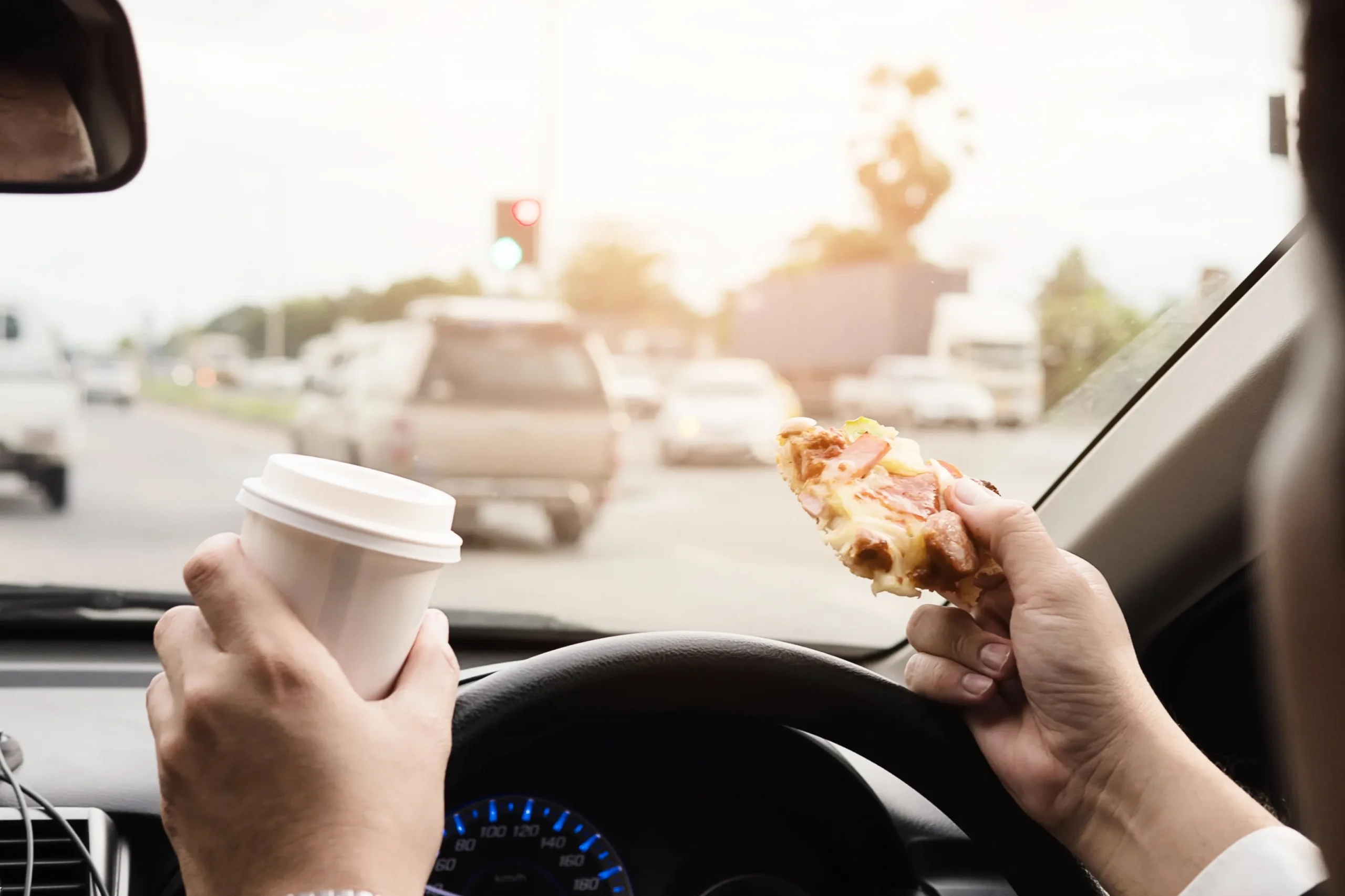 Eating and drinking while driving.